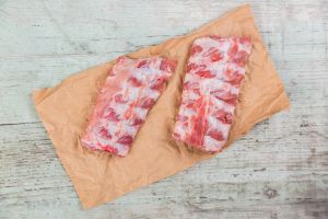 Raw spare ribs on brown paper